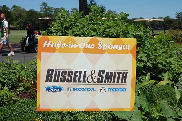 Hole-in-One sponsor sign on a golf course